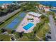 Aerial view of community with pool, tennis courts, and clubhouse at 4540 Gulf Of Mexico Dr # Ph1, Longboat Key, FL 34228