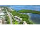 Aerial view of waterfront condo community with tennis courts nearby at 4540 Gulf Of Mexico Dr # Ph1, Longboat Key, FL 34228