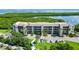 An aerial view showcasing a condo building's waterfront location at 4540 Gulf Of Mexico Dr # Ph1, Longboat Key, FL 34228