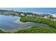 Aerial view showcasing waterfront property near beach and waterways at 4540 Gulf Of Mexico Dr # Ph1, Longboat Key, FL 34228