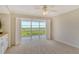 Bedroom with balcony access and built-in storage at 4540 Gulf Of Mexico Dr # Ph1, Longboat Key, FL 34228