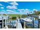 Two boat slips with boats in a waterfront community at 4540 Gulf Of Mexico Dr # Ph1, Longboat Key, FL 34228