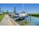 Boat docks alongside a walkway, offering convenient access at 4540 Gulf Of Mexico Dr # Ph1, Longboat Key, FL 34228