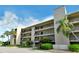 Condo building exterior showcasing its architecture and landscaping at 4540 Gulf Of Mexico Dr # Ph1, Longboat Key, FL 34228