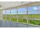 Lanai boasts expansive windows showcasing scenic waterfront views at 4540 Gulf Of Mexico Dr # Ph1, Longboat Key, FL 34228