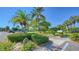 Landscaped grounds with tropical plants and walkways at 4540 Gulf Of Mexico Dr # Ph1, Longboat Key, FL 34228