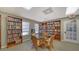 Community library with ample seating and bookshelves at 4540 Gulf Of Mexico Dr # Ph1, Longboat Key, FL 34228