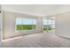 Bright living room with large windows offering scenic water views at 4540 Gulf Of Mexico Dr # Ph1, Longboat Key, FL 34228