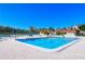 Inviting community pool area with lounge chairs and nearby tennis courts at 4540 Gulf Of Mexico Dr # Ph1, Longboat Key, FL 34228