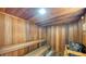 Relaxing sauna with wooden benches and a heater at 4540 Gulf Of Mexico Dr # Ph1, Longboat Key, FL 34228