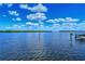 Calm water view with blue skies and fluffy clouds at 4540 Gulf Of Mexico Dr # Ph1, Longboat Key, FL 34228