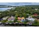 Wide aerial view of a waterfront property and neighborhood at 1400 Quail Dr, Sarasota, FL 34231