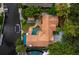 Aerial view of a home featuring a large pool and canal views at 1400 Quail Dr, Sarasota, FL 34231