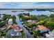 Aerial view showcasing a waterfront home and its surroundings at 1400 Quail Dr, Sarasota, FL 34231