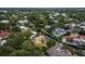 Aerial view of waterfront homes and lush landscaping at 1400 Quail Dr, Sarasota, FL 34231