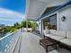 Relaxing balcony with composite decking and comfortable seating at 1400 Quail Dr, Sarasota, FL 34231