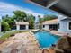 Inviting pool area with flagstone patio at 1400 Quail Dr, Sarasota, FL 34231