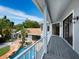 Elevated balcony overlooking a private pool and backyard oasis at 1400 Quail Dr, Sarasota, FL 34231