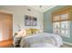 Bedroom with ensuite bathroom and calming color scheme at 445 N Orange Ave # 309, Sarasota, FL 34236