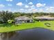 Luxury home with pool and screened enclosure, overlooking a pond at 10622 Cheval Pl, Lakewood Ranch, FL 34202