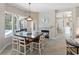 Cozy dining area featuring a fireplace and large windows at 10622 Cheval Pl, Lakewood Ranch, FL 34202