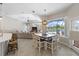 Bright dining area with a large table and pool view at 10622 Cheval Pl, Lakewood Ranch, FL 34202