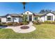 Elegant two-story home with manicured lawn and walkway at 10622 Cheval Pl, Lakewood Ranch, FL 34202