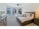 Main bedroom with pool view, large bed, and ample natural light at 10622 Cheval Pl, Lakewood Ranch, FL 34202