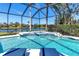 Inviting screened pool with tiled water feature and lounge chairs at 10622 Cheval Pl, Lakewood Ranch, FL 34202