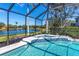 Relaxing screened pool and spa with lake view at 10622 Cheval Pl, Lakewood Ranch, FL 34202