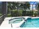 Private spa with a water feature adjacent to the pool at 10622 Cheval Pl, Lakewood Ranch, FL 34202