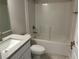 Bathroom featuring granite countertop vanity and bathtub with white backsplash at 2968 Yacolt Ave, North Port, FL 34286