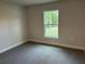 Neutral bedroom with carpet and a bright window view at 2968 Yacolt Ave, North Port, FL 34286