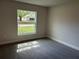 Bedroom with a sunny street view from the window at 2968 Yacolt Ave, North Port, FL 34286