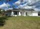 Well-maintained one-story home with green lawn and an attached garage at 2968 Yacolt Ave, North Port, FL 34286