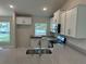 Modern kitchen features stainless steel appliances, granite countertops, and white cabinets at 2968 Yacolt Ave, North Port, FL 34286