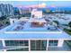 Aerial view of building and rooftop amenities at 111 Golden Gate Pt # 201, Sarasota, FL 34236