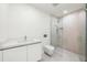 Contemporary bathroom with a walk-in shower and floating vanity at 111 Golden Gate Pt # 201, Sarasota, FL 34236