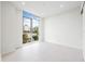 Bright bedroom with large window and city view at 111 Golden Gate Pt # 201, Sarasota, FL 34236