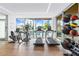 Modern fitness center with treadmills, elliptical machines, and free weights at 111 Golden Gate Pt # 201, Sarasota, FL 34236