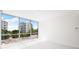 Bright living room with large windows offering city views at 111 Golden Gate Pt # 201, Sarasota, FL 34236