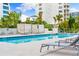 Relaxing pool area with cabanas and lounge chairs at 111 Golden Gate Pt # 201, Sarasota, FL 34236