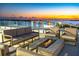 Rooftop terrace with fire pit and seating at 111 Golden Gate Pt # 201, Sarasota, FL 34236