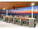 Rooftop terrace with bar and sunset view at 111 Golden Gate Pt # 201, Sarasota, FL 34236