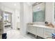 Modern bathroom with double vanity and marble floors at 1155 N Gulfstream Ave # 208, Sarasota, FL 34236