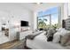 Bright bedroom with king-size bed, large window, and city view at 1155 N Gulfstream Ave # 208, Sarasota, FL 34236