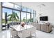 Modern dining area with white table and chairs and a view at 1155 N Gulfstream Ave # 208, Sarasota, FL 34236