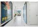 Modern entryway with a large piece of art and glass doors at 1155 N Gulfstream Ave # 208, Sarasota, FL 34236