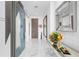 Bright entryway with marble floors and modern accents at 1155 N Gulfstream Ave # 208, Sarasota, FL 34236