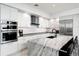 Modern kitchen featuring stainless steel appliances and expansive island at 1155 N Gulfstream Ave # 208, Sarasota, FL 34236